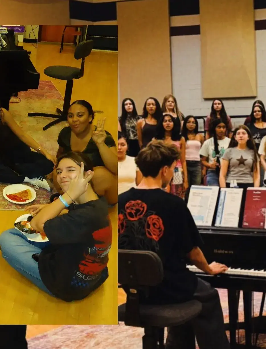 Singers laughing together on the choir room floor during the fall retreat